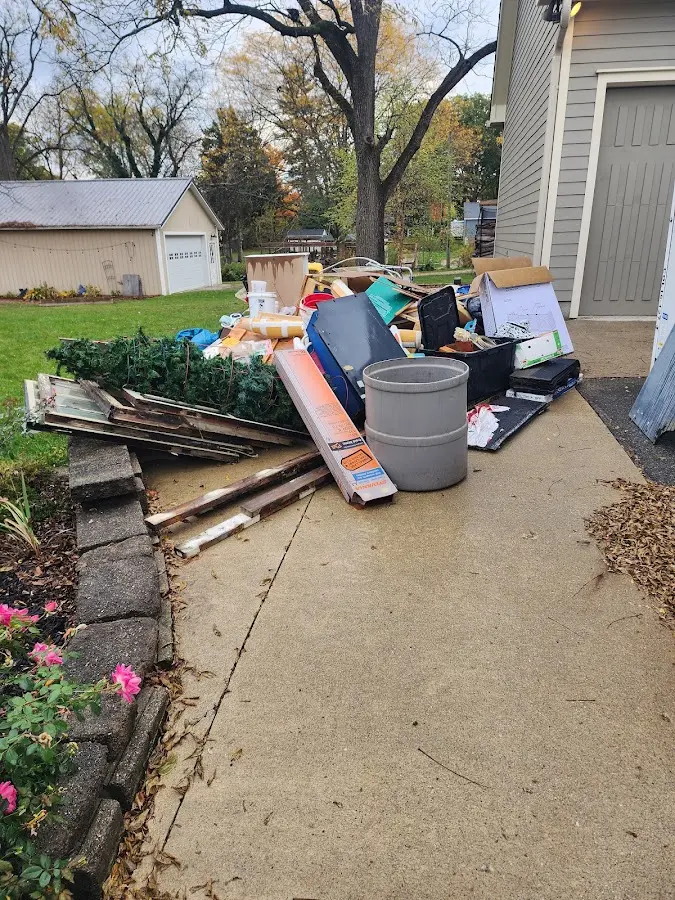Dumpster being loaded with debris for 3 Yard Dumpster Rental in Kenai